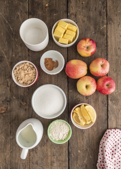 Ingredients to make bottomless apple pie in separate bowls.