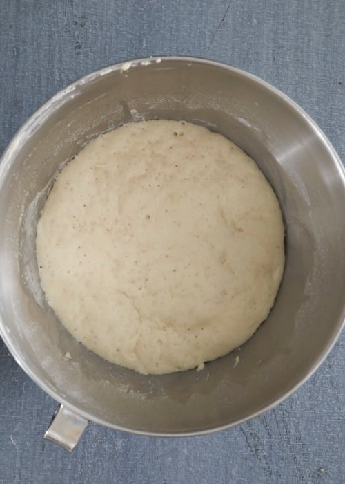 Dough doubled in size in a bowl.