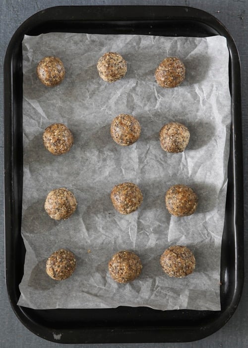 Salted caramel energy balls on a baking sheet.