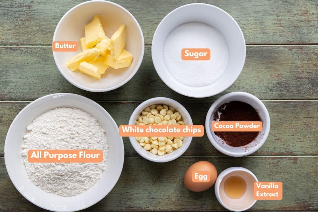 Crunchy white chocolate chip cookies ingredients in separate bowls.