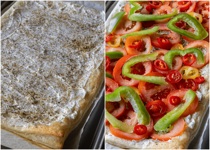 Puff pastry on a baking sheet with mascarpone spread on top and topped with vegetables and herbs.