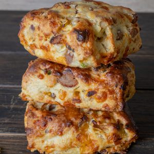 Three jalapeno sausage biscuits stacked.