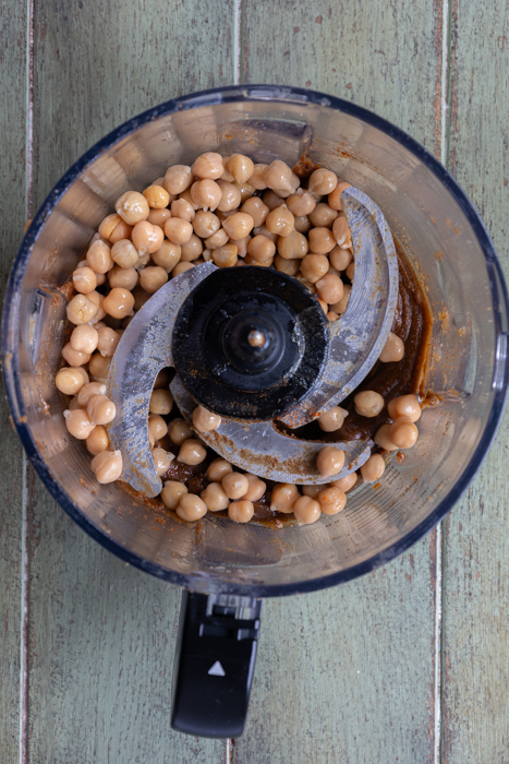Chickpeas added to the food processor.