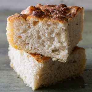 Two pieces of discard focaccia one on top of the other.